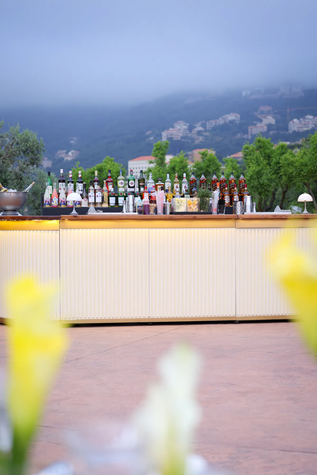 Front view of the Cream Bar with bottles arranged against a mountain backdrop