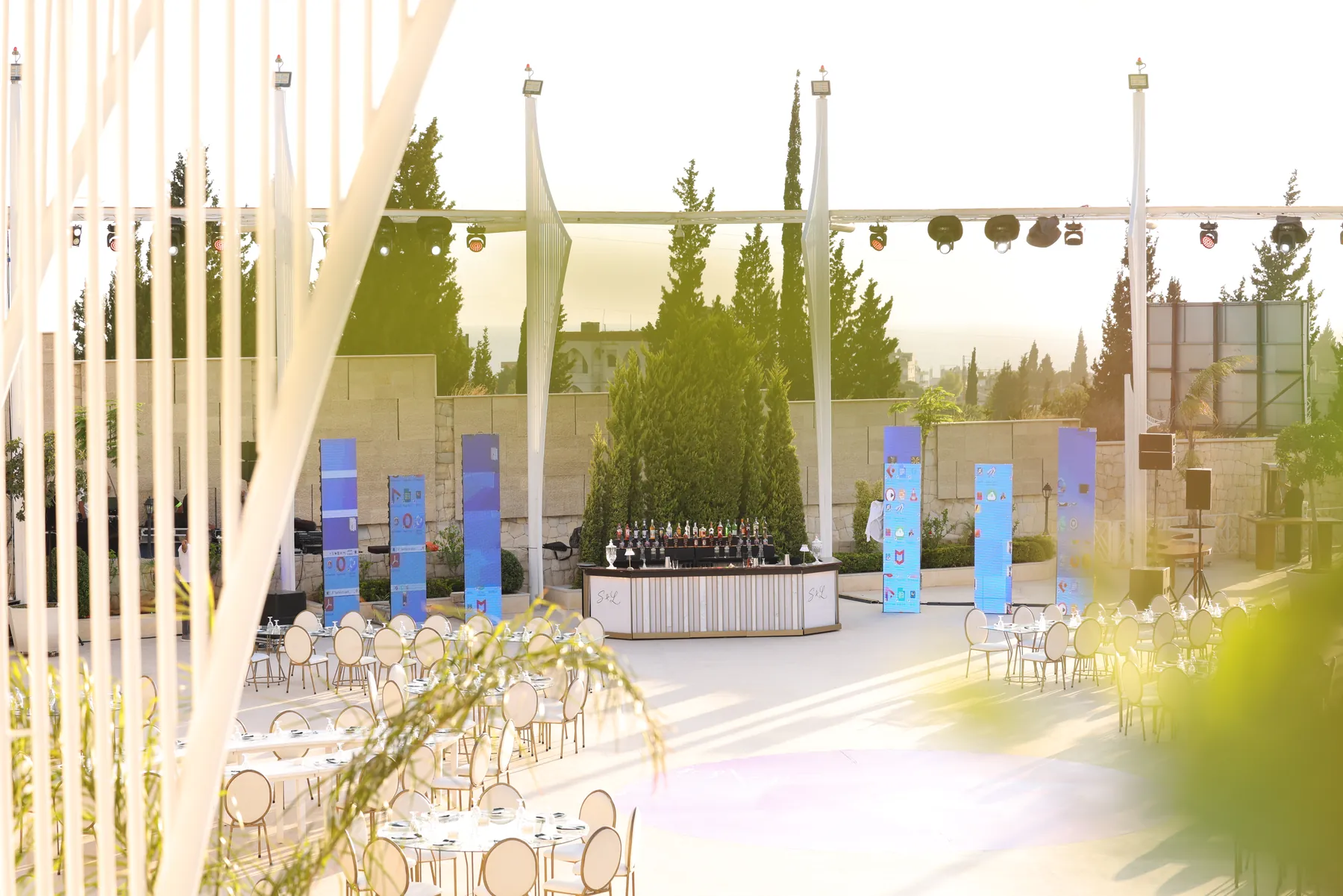 Wide daylight view of the Pannel Bar within the event setting