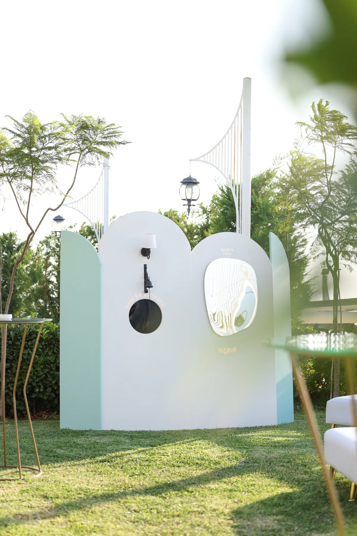 The Ambiance station in a garden, framed by soft foreground foliage